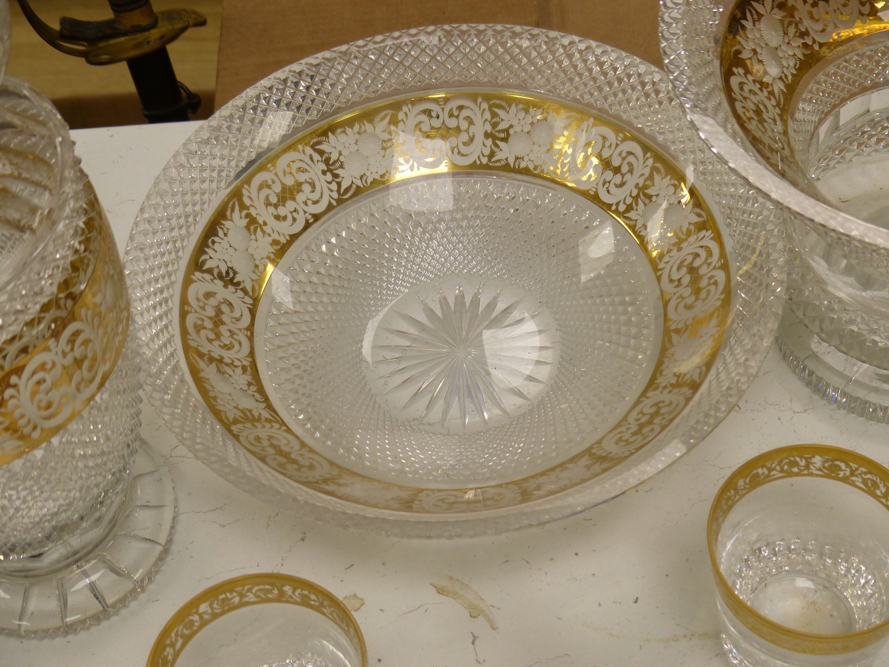 A Moser style tall tapered cut glass vase heightened in gilt, a similar circular bowl, a pedestal bowl and two St Louis tumblers